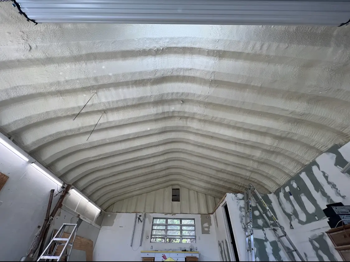 Spray polyurethane foam applied to the underside of a metal roof deck in West Falls Church